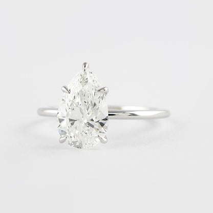 1.5 CT Pear Cut Solitaire Style Moissanite Engagement Ring